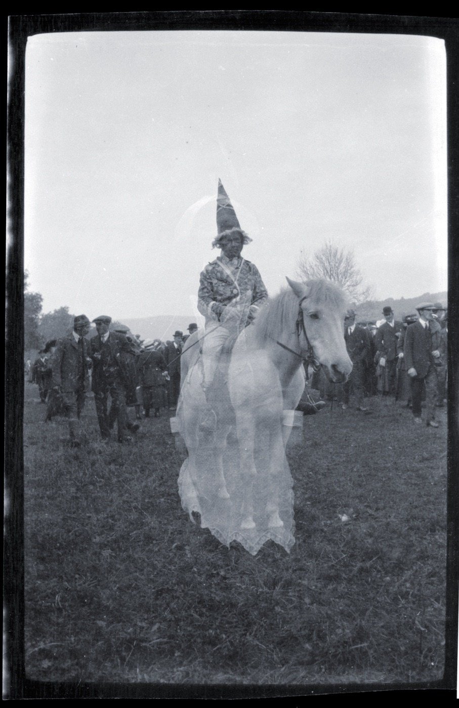 From the late Jack Douglas's set of negatives . The 1919 Peace Celebrations on Tyne Willow, Alston.A white horse and fantastic rider double exposed- maybe with a woman in white?