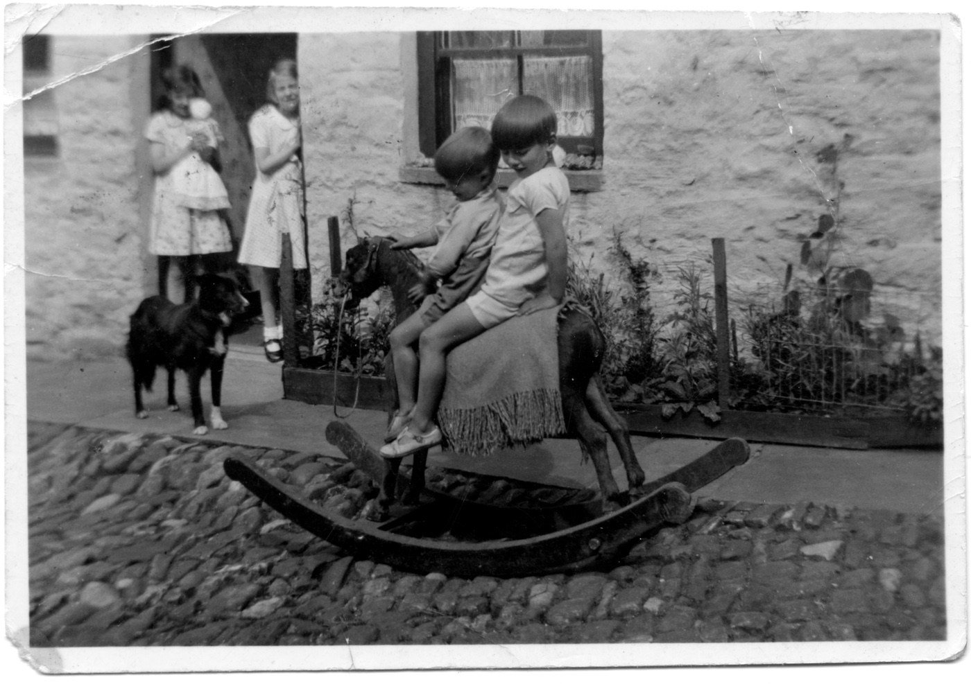 Down Kate's Lane, Alston. Alwyn and Neil Hind on their rocking horse. One of my favourite images of childhood.