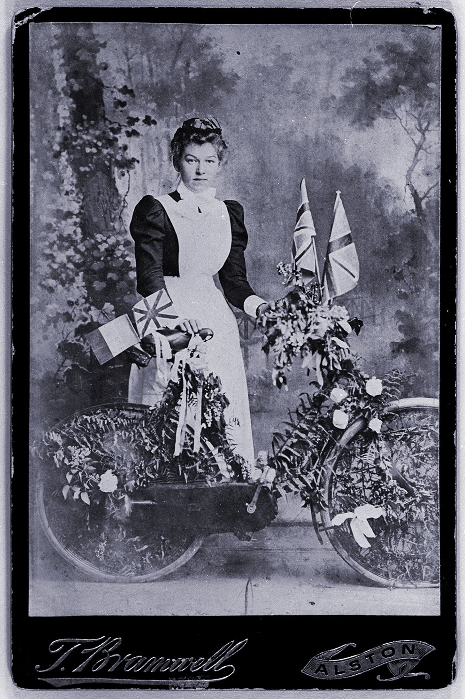 Digitally tinted image. Margaret Farrer, daughter to Police Sgt. Farrer. Her last child, Winnie Henderson, became Winnie Elliot on marrying John. Margaret was to die shortly after that birth. Much of the span of her life is depicted in my full collection.
Photo by  Thomas Bramwell, presumably in his studio prior to a parade.