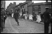 Coll. Jack Douglas 1 Park View Lane, Alston CA9 3TW Tel 381795. Copied into archive with permission Nov 2009.
1919 Peace Celebrations in Alston- July 19th
These photographs were probably taken by Jack's father, Mark.
George White in the Ewe and Lamb, Alston Drug Company, Walter Willson's and the Victoria Hotel all showing.
A man with gloved? hand runs from the gathering parade. A dog barks at the float driven by John Willie Cousin.