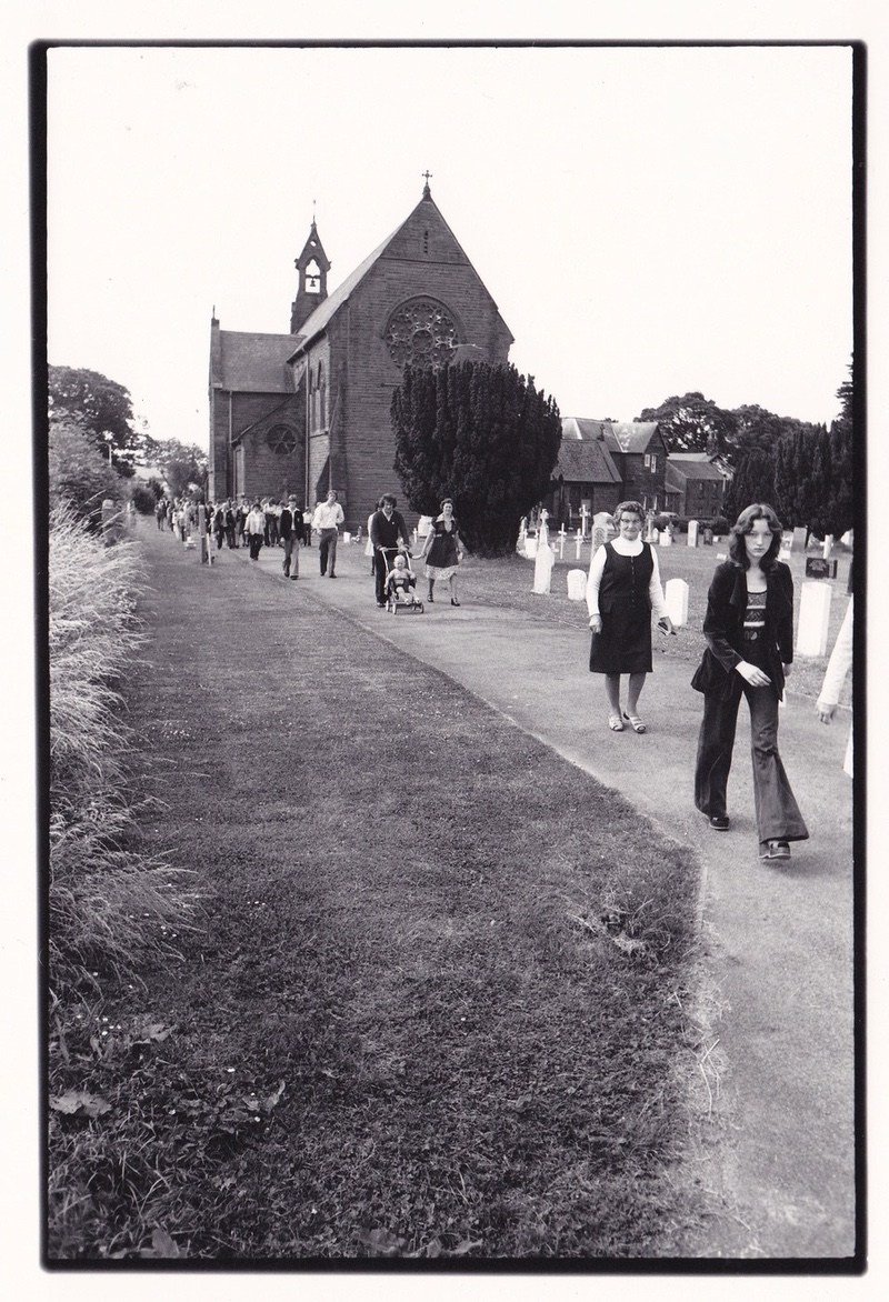 Big Hill Adventure Playground was sited on a 5 acre,(2 hectares) old iron ore quarry. The land was gifted/sold cheaply to the parish by the R Catholic Church adjoining.
The playground was always open and staffed on a Sunday, (by me). Folk would be seen walking down for morning Mass- dressed in their "Sunday best". After Mass, quite a few would go to the pub or Working Men's Club- maybe even the Knights of St Columba Club for a drink before dinner. No-one of the Catholic population would dream of entering the Freemason's Club- also on the main Square. In my first week I was shown the spot where, "We once shot a Protestant". It is thought that Orange marches are still not permitted by law to pass through C Moor.
Women from the CDP offices- mostly locals- once invaded the Men Only bar at the W M Club- after which they were "allowed to join the menfolk there! The Club has ceased to operate- its site now a medical centre, (2016)