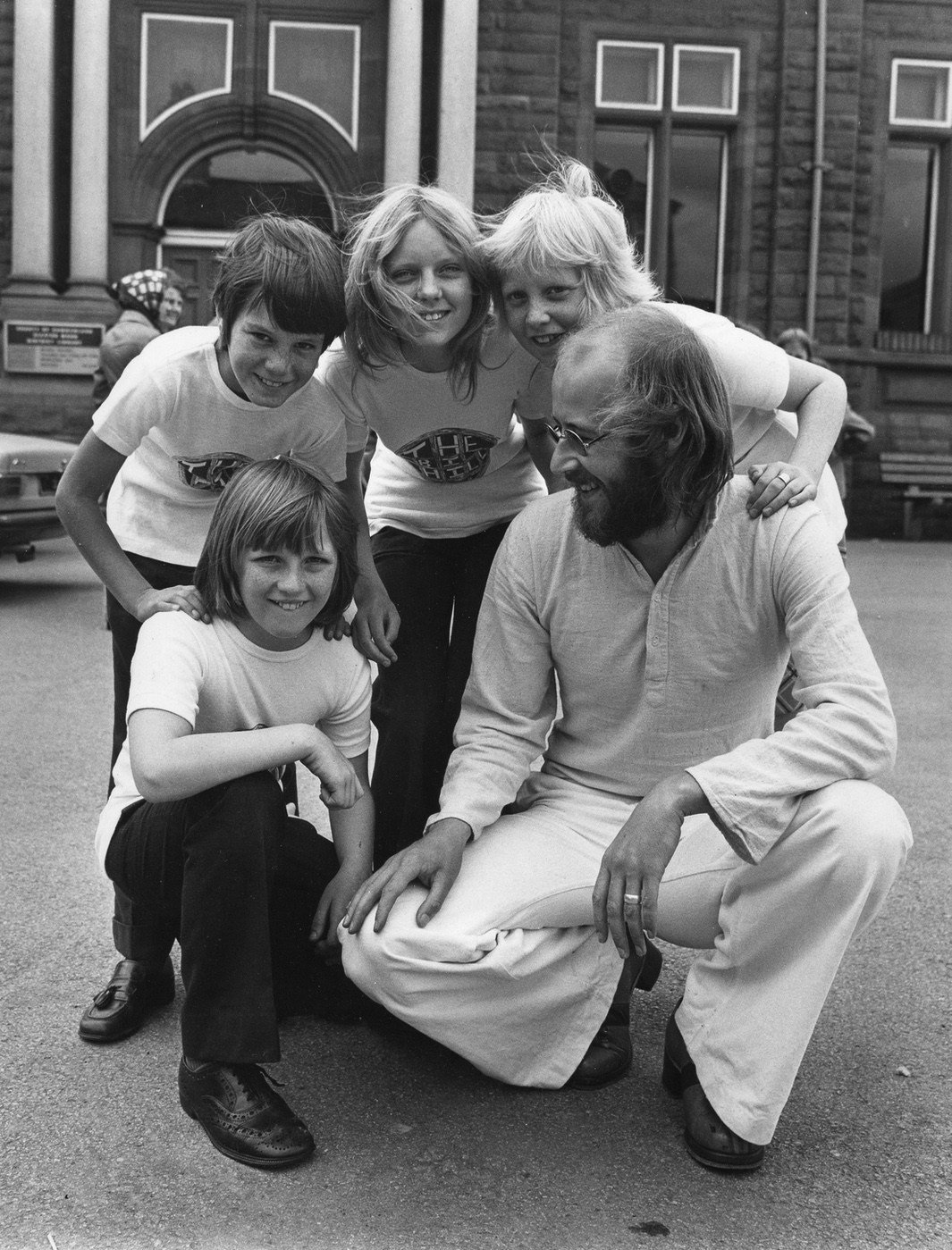 Big Hill adventure playground, Cleator Moor. playleader and young supporters with T-shirts designed by Phil Coleman, kneeling, left.
Behind SPD is Wendy Southward/Rigg.
 Roger Savage, Whitehaven, 1972/3