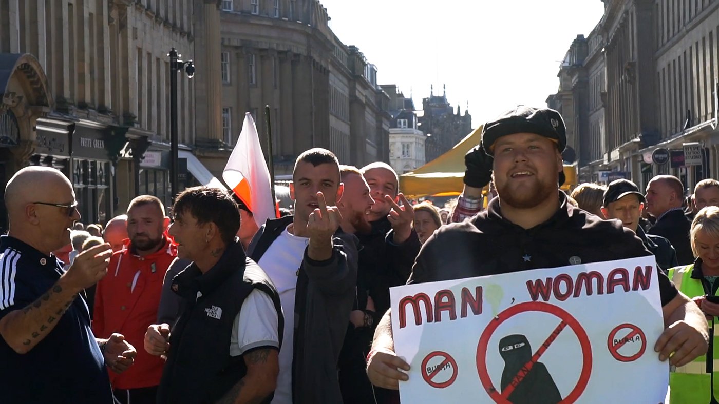 Getting the finger. "Ban the Burka" Grainger Street, Newcastle. "Burqa" perhaps. Many arrived, onb oth sides, wearing the niqab.